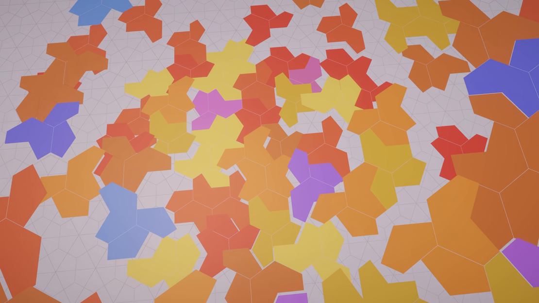 The same tiling mid-generation, with unfilled hexagonal cells still visible around the growing patch of coloured tiles